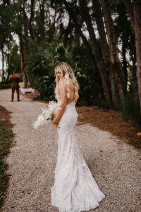 Ivory White Lace Backless Illusion Ines Di Santo Wedding Dress | Bride and Groom First Look Portrait