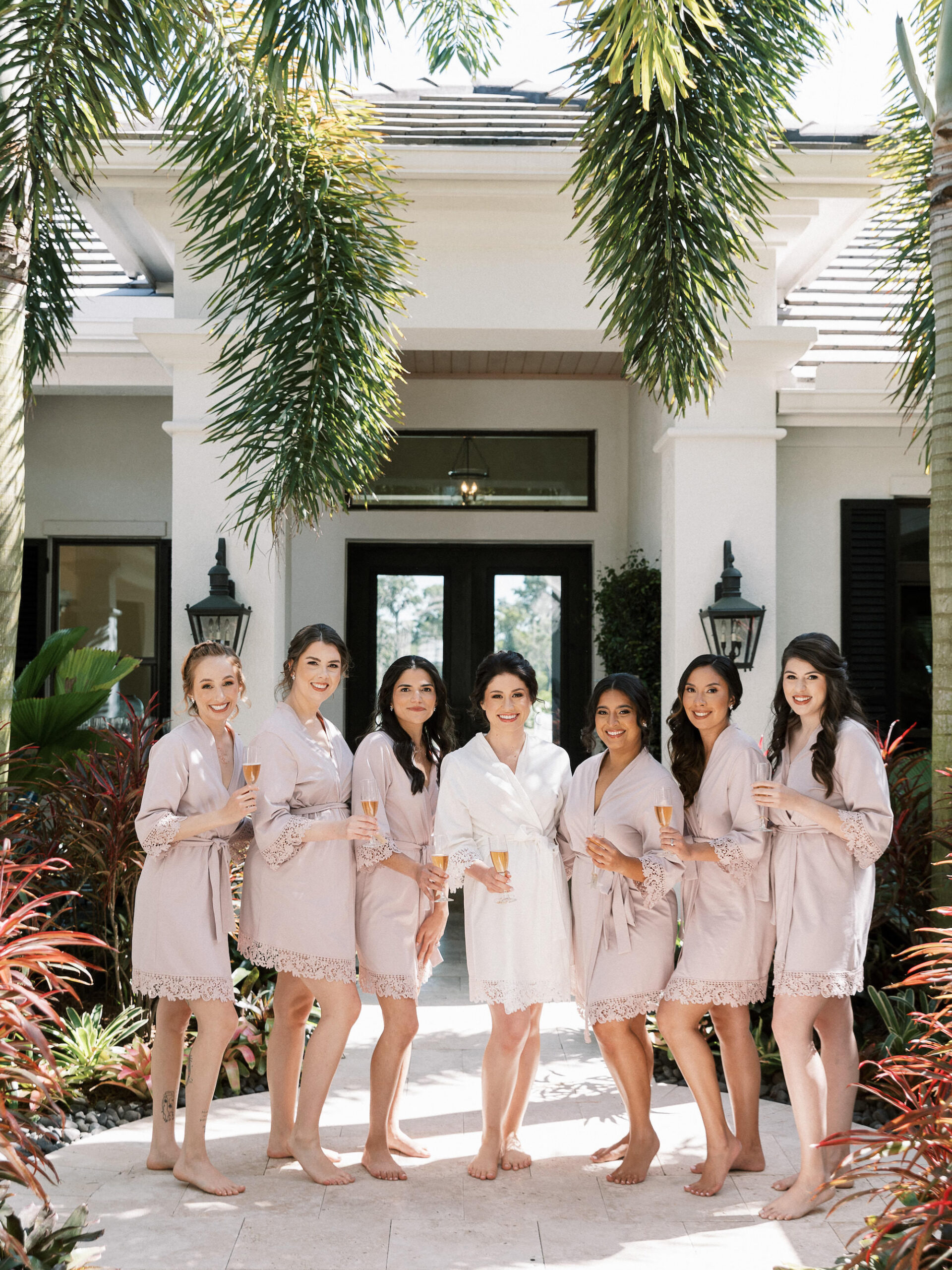 Old Florida Elegant Bride Getting Wedding Ready with Bridesmaids in Matching Taupe Robes | Tampa Wedding Venue Concession Golf Club