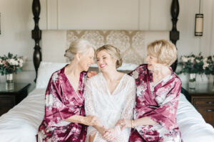 Bride and Mothers of the Bride in Silk Floral Robes Getting Ready Wedding Portrait | Tampa Hair and Makeup Femme Akoi