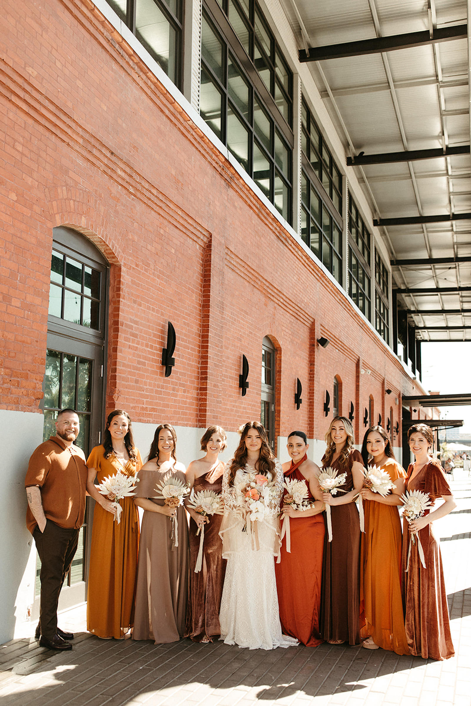 Earthy Neutral Boho Modern Chic Bridal Party, Bridesmaids Wearing Mix and Match Terracotta, Gold and Bronze Dresses | Tampa Bay Wedding Venue Armature Works