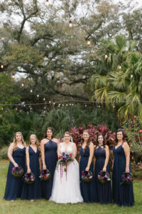 Bride with Bridesmaids in Navy Mix and Match Style Bridesmaids Dresses Wedding Portrait