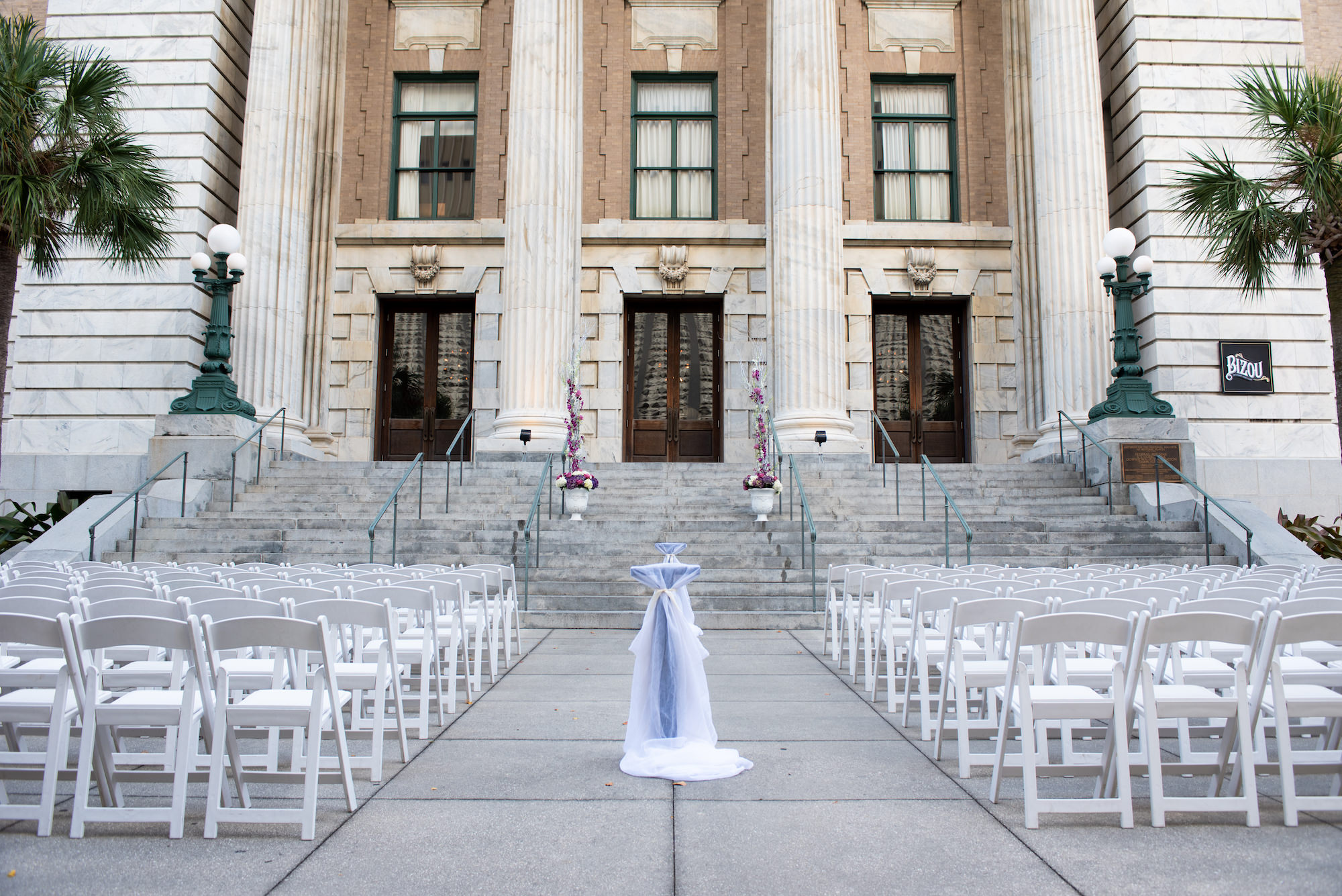 Outdoor Wedding Ceremony with White Garden Chairs and Purple Decor | Historic Downtown Tampa Le Meridien