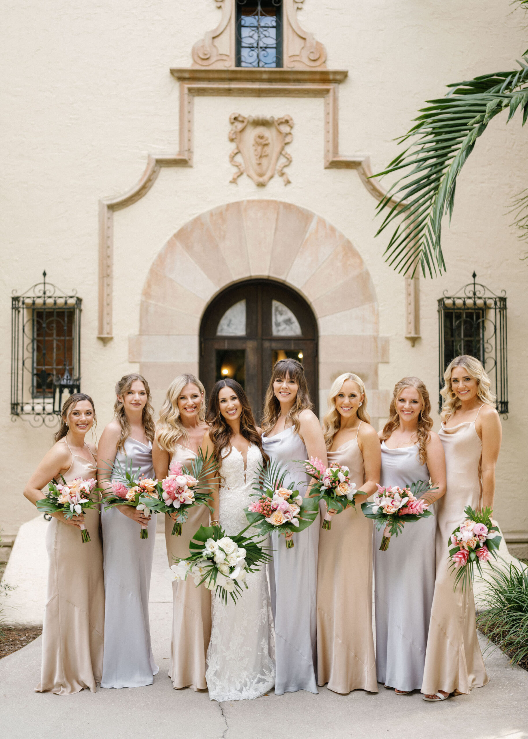 Luxurious Classic Wedding, Bridesmaids Wearing Matching Champagne and Silver Silk Dresses Holding Tropical Floral Bouquets | Tampa Bay Wedding Florist Botanica International Design Studio