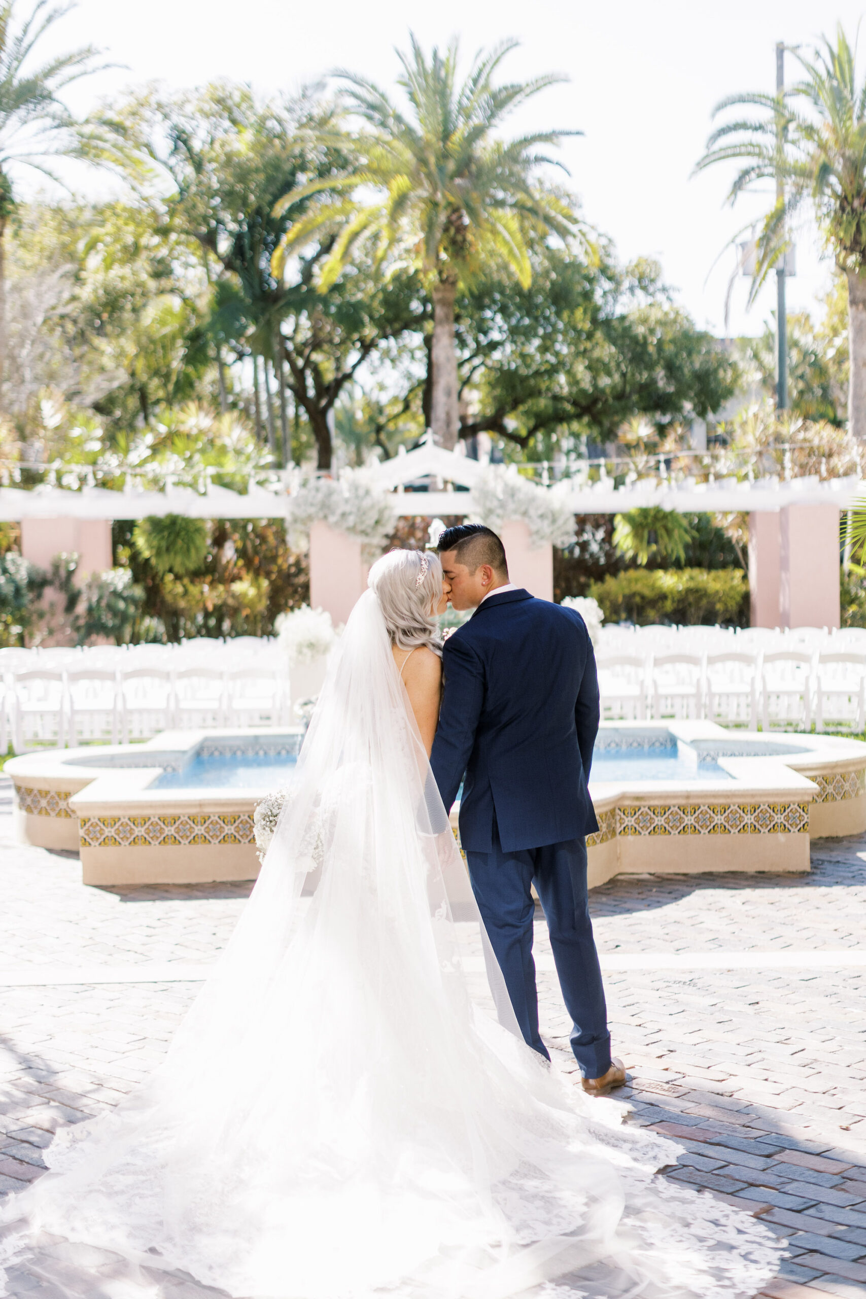 Romantic First Look Kiss Outdoor Courtyard Ceremony Fountain | St. Pete Wedding Venue The Vinoy Resort & Golf Club | Planner Parties a la Carte