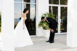 Classic and Timeless Bride and Groom Outdoor First Look Wedding Portrait | Wedding Venue Tampa Garden Club | Wedding Hair and Makeup Femme Akoi Beauty Studio