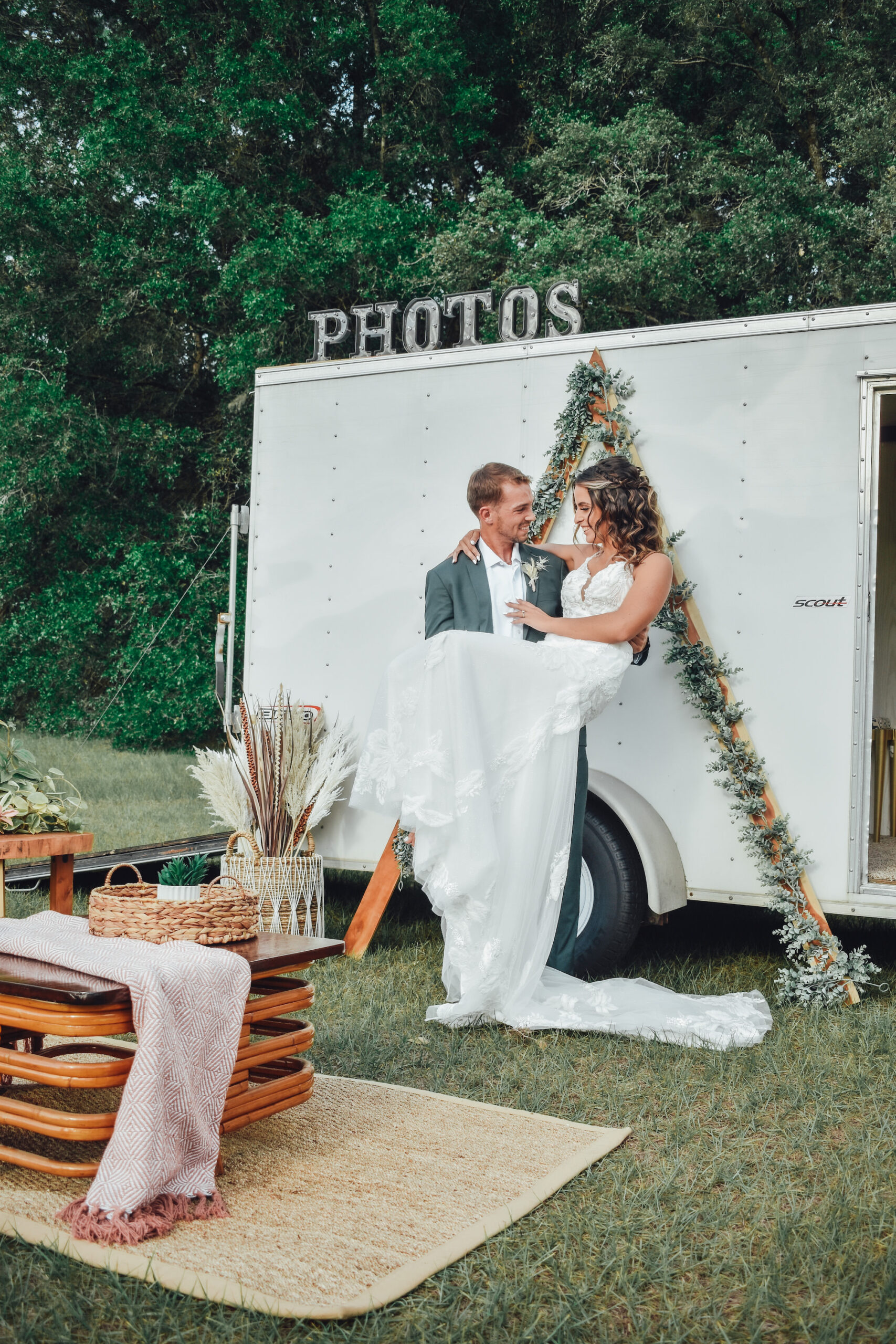 Bride and Groom with Boho Outdoor Photo Booth at Wedding Reception | Wedding Planner Kelci Leigh Events