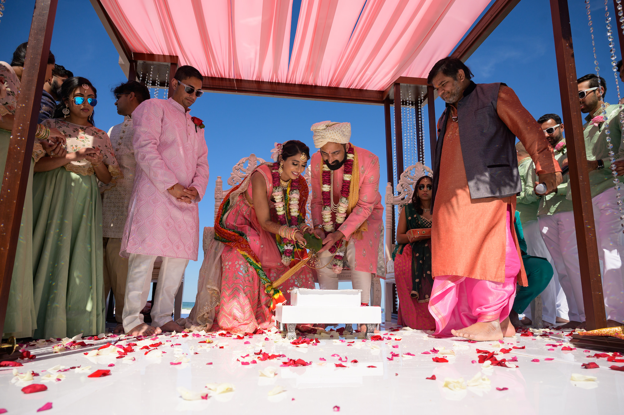 Bride and Groom under Mandap Altar during Beachfront Indian Wedding Ceremony | Florida Destination Wedding Venue Hilton Clearwater Beach