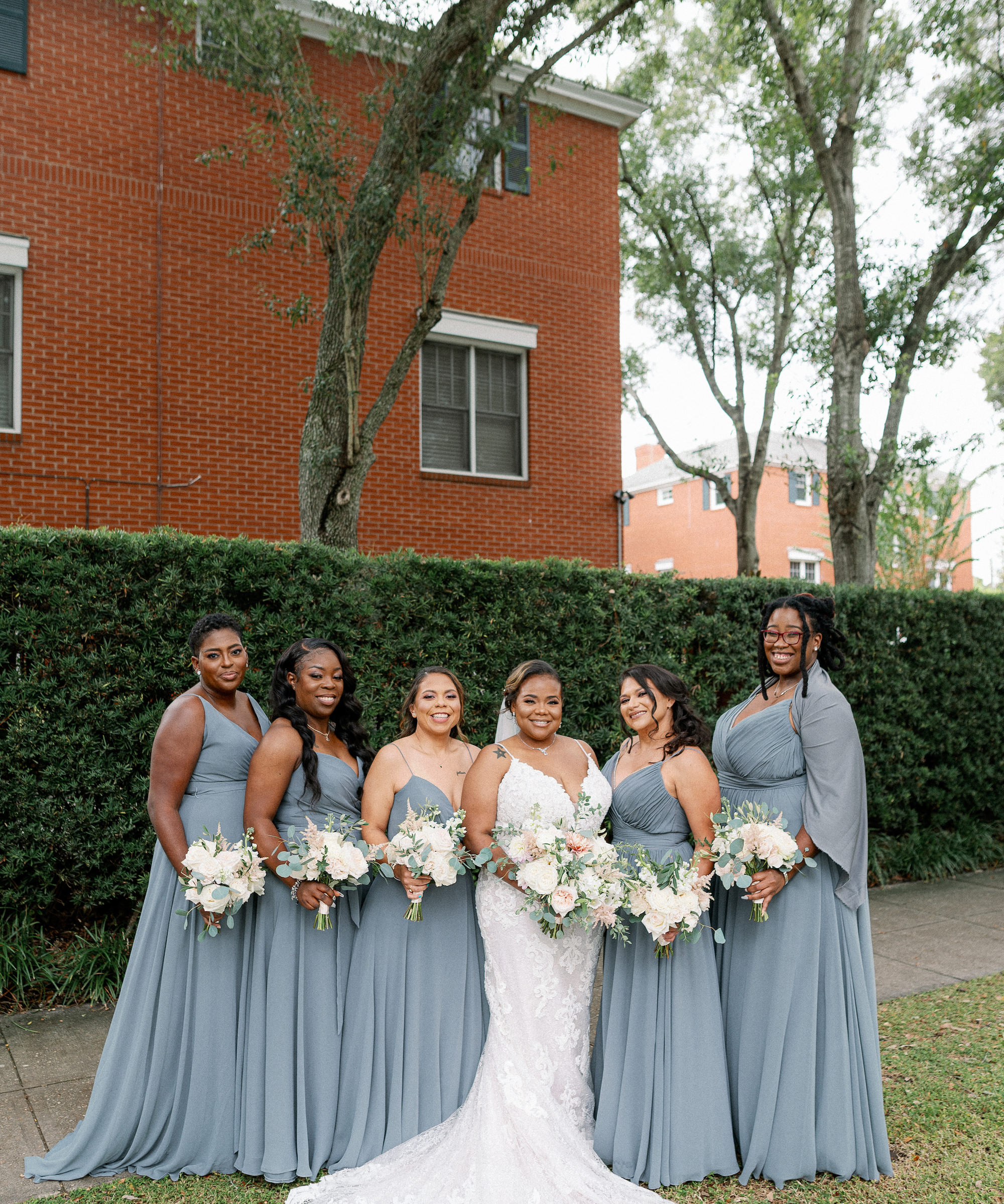 Same Sex Lesbian Wedding, Bride with Bridesmaids Wearing Mix and Match Gray Dresses Holding White and Greenery Floral Bouquets | Tampa Bay Wedding Photographer Dewitt for Love | Wedding Hair and Makeup Imago Dei by Milan