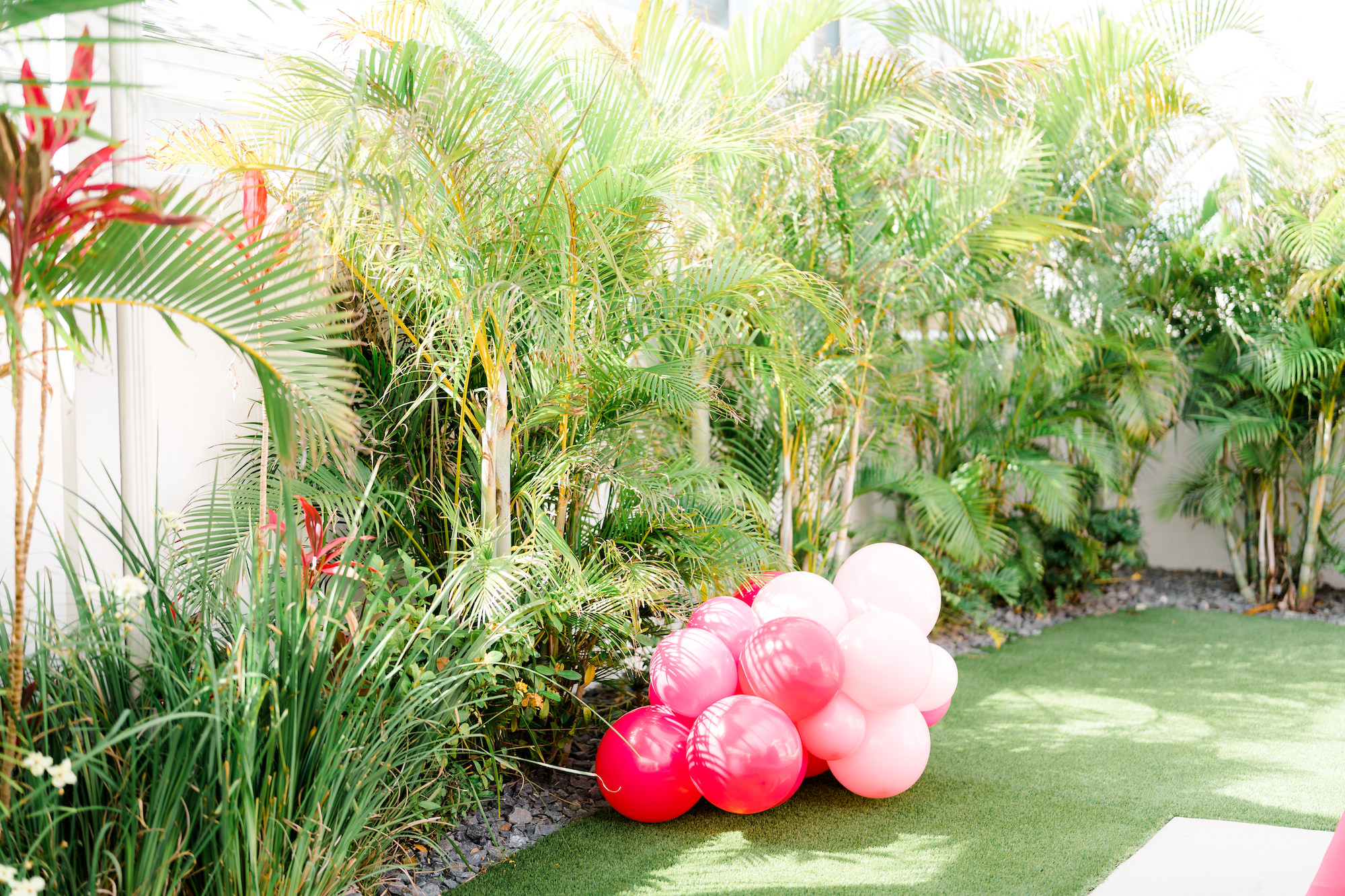 Whimsical Outdoor Wedding Cocktail Hour Decor with Pink Balloons