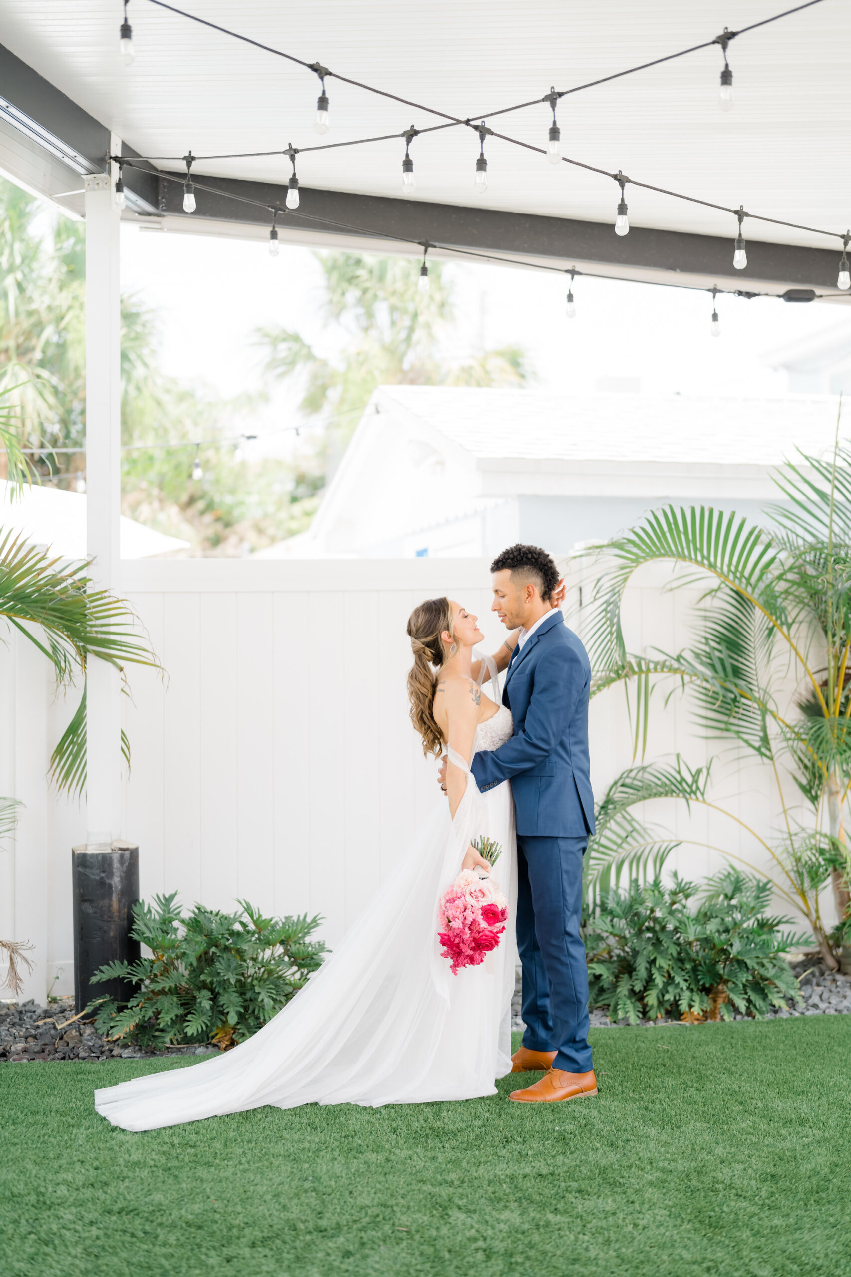 Bride and Groom Wedding Portrait Under Tent with String Lights | Madeira Beach Wedding Venue The West Events