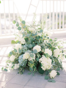 White and Greenery Floral Details at Wedding Ceremony