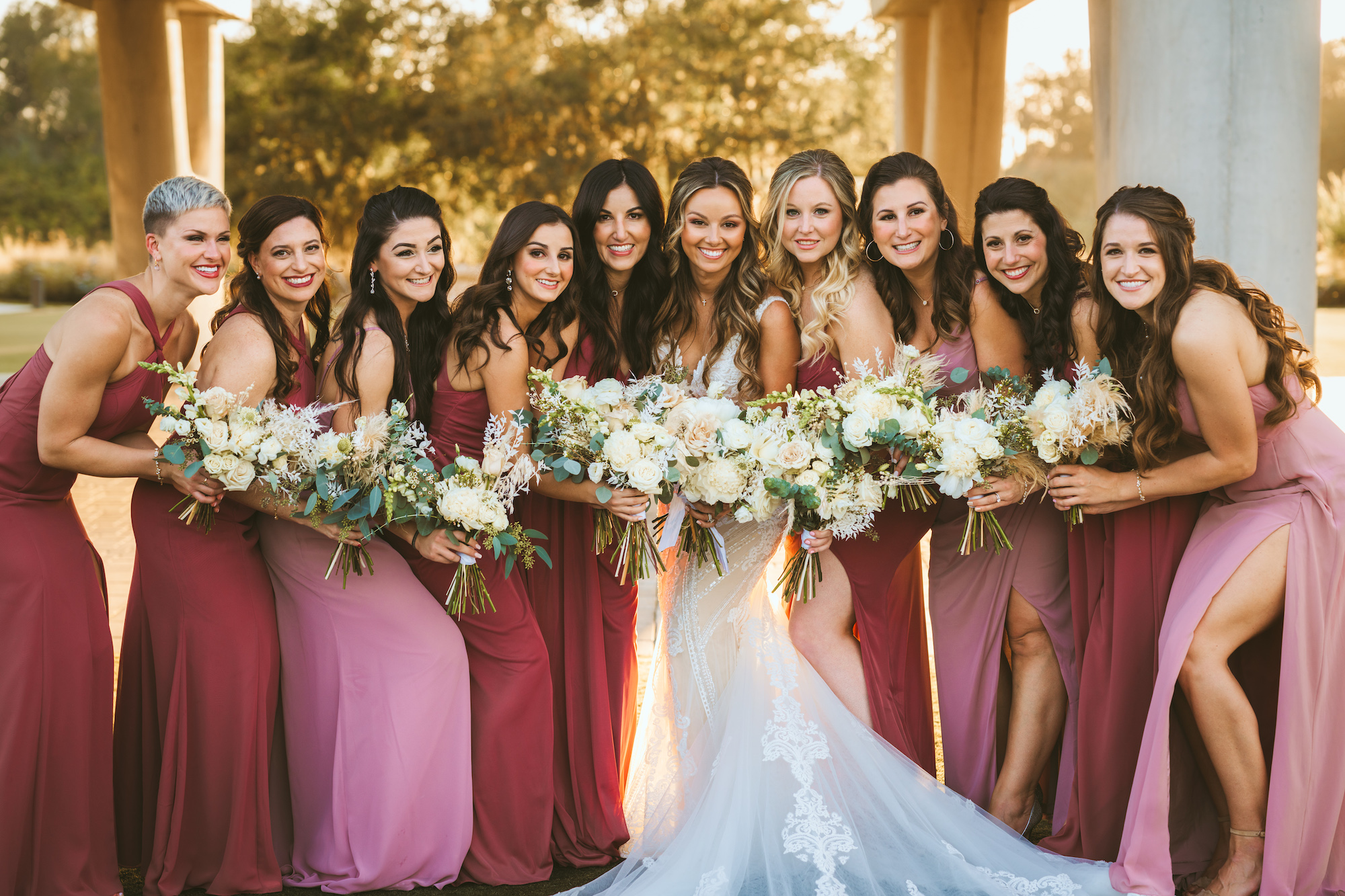 Bride with Bridesmaids in Mix and Match Red and Pink Bridesmaids Floor Length Dresses Wedding Portrait | Florida Photographer Mars and The Moon Films