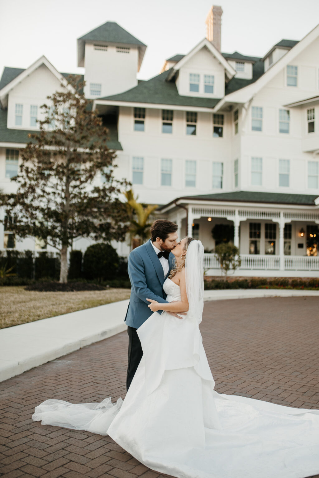 Romantic Bride and Groom Outdoor Kiss | Romantic Garden Estate Clearwater Wedding Venue Belleview Inn | Planner Elegant Affairs by Design