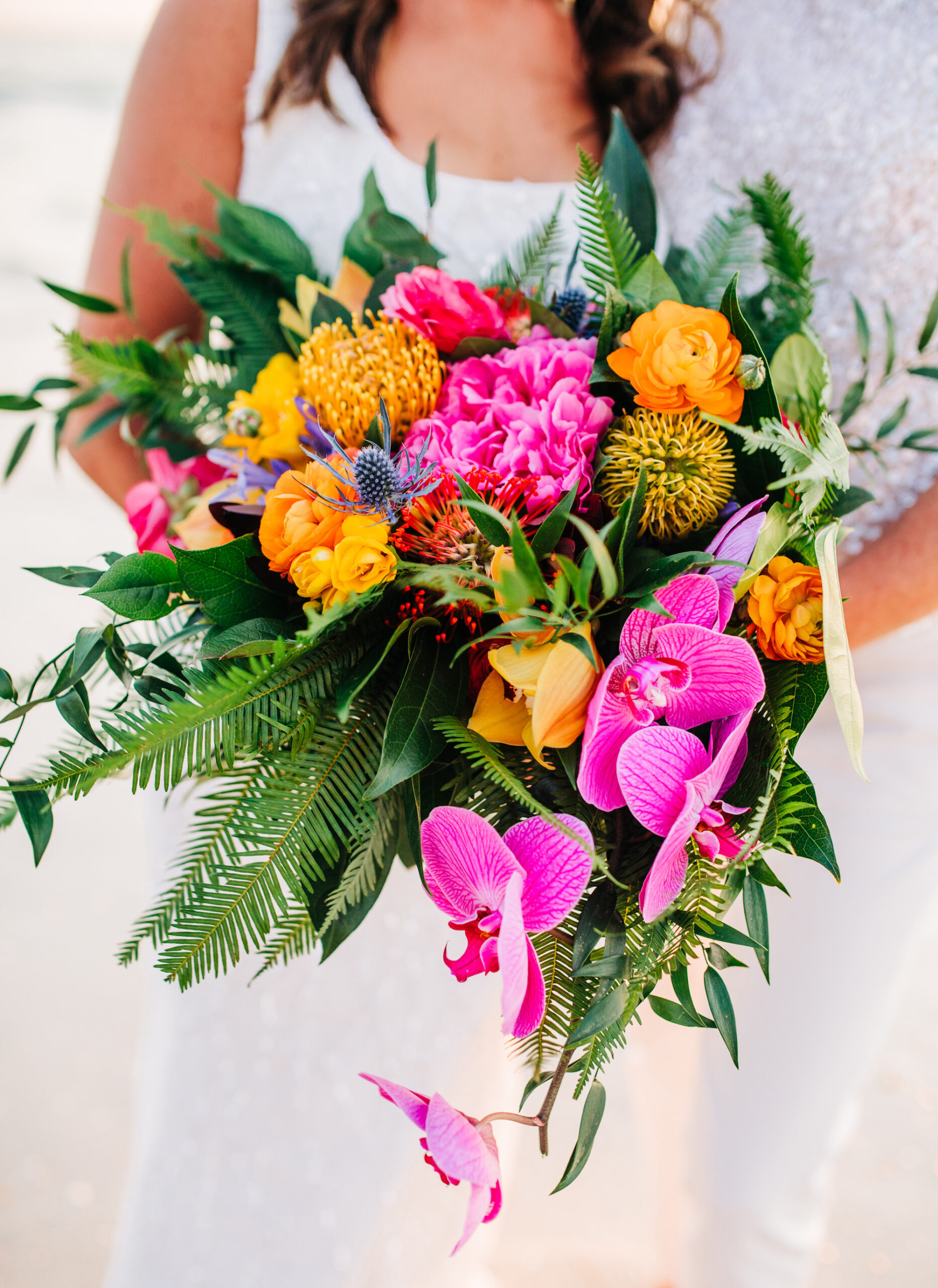 Vibrant Colorful Same Sex Wedding, Pink Orchids, Yellow Pincushions, Orange Roses, Greenery, Palm Leaves Floral Bouquet