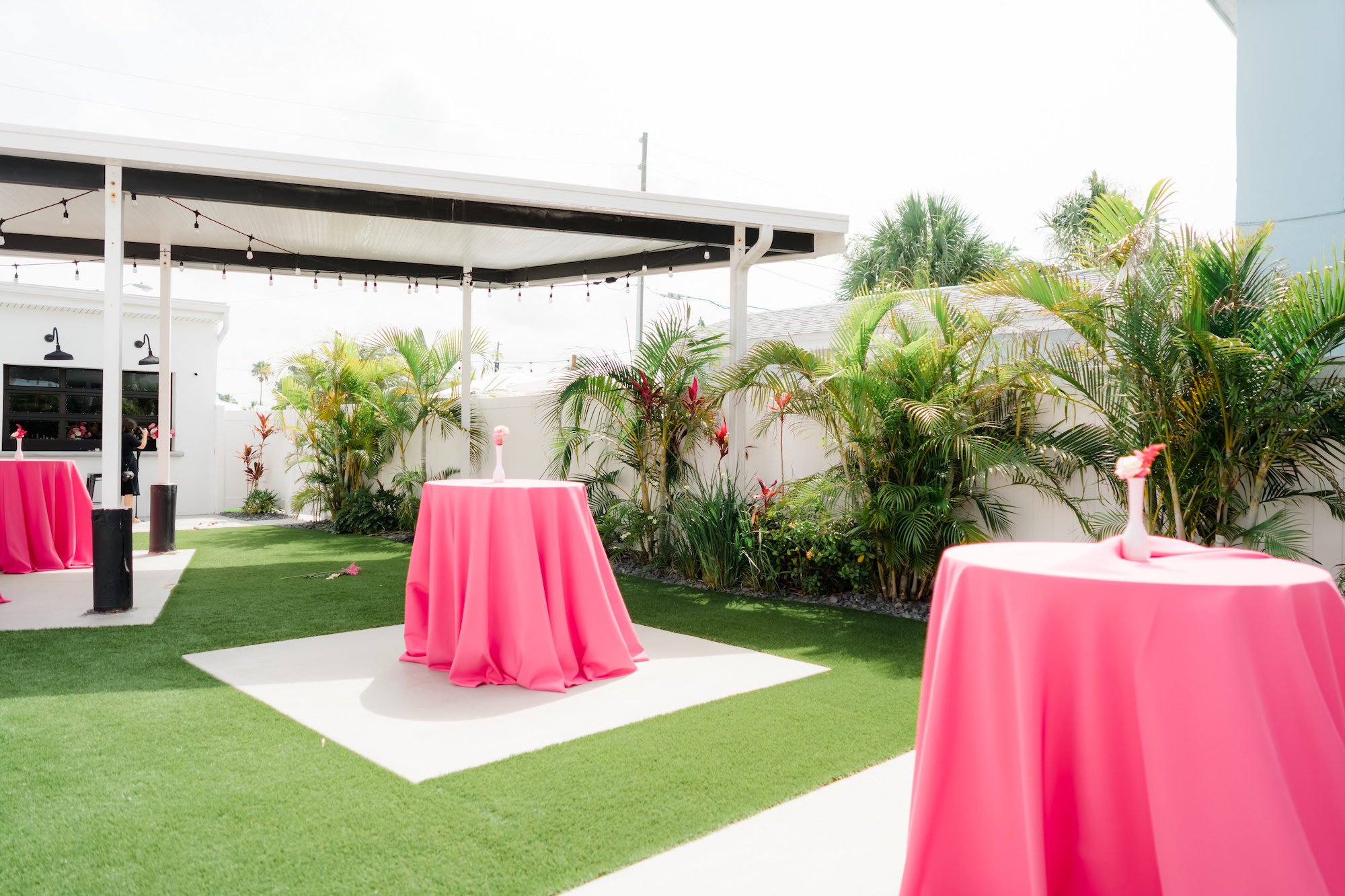 Whimsical Pink and Fuchsia Outdoor Courtyard Wedding Decor, High Cocktail Tables with Pink Linens | Tampa Bay Wedding Venue The West Events