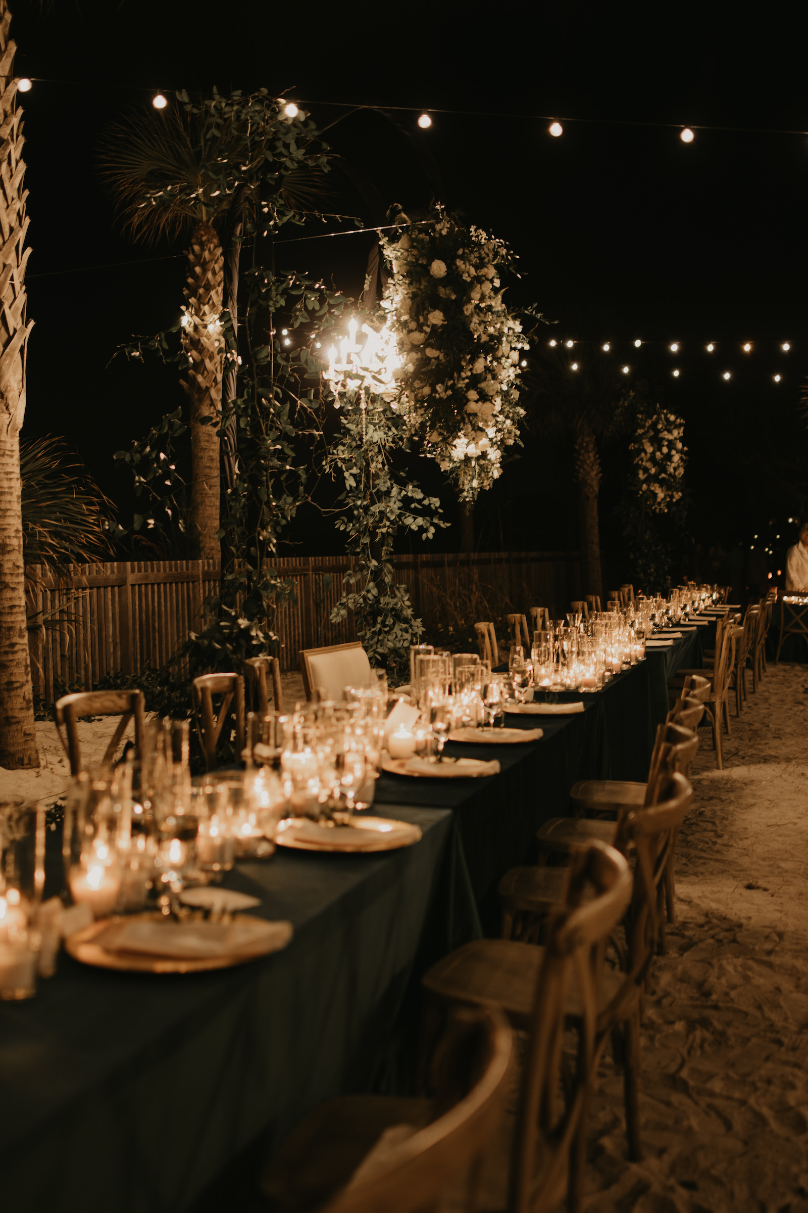 Whimsical Garden Beach with Long Feasting Tables and Candle Centerpieces | Outdoor Wedding Reception Ideas | Sarasota Lighting and Rental Company Gabro Event Services