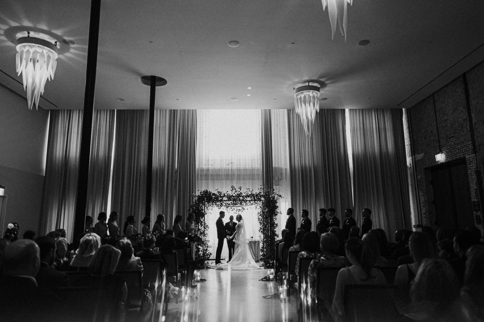 Modern Minimalist Greenery Ceremony Arch and Candlelit Aisle Decor | Tampa Bay Wedding Planner Coastal Coordinating | Ybor City Wedding Venue Hotel Haya Valencia Ballroom | Florist Monarch Events and Design