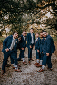 Boho Vintage Wedding, Groomsmen Wearing Navy Blue Suit in Matching Brown Dress Shoes and Matching Star Wars Socks