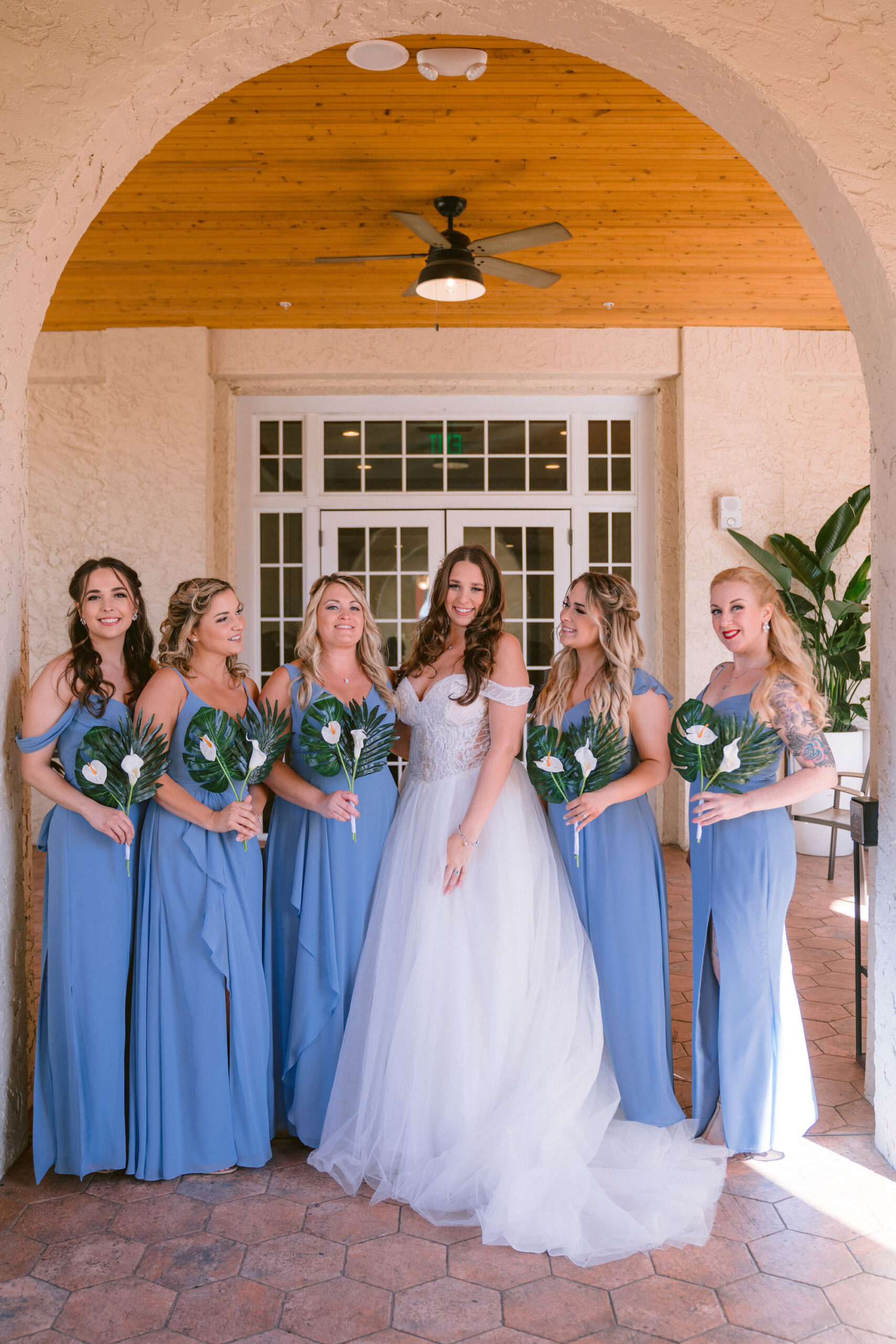 Bride with Bridesmaids in Dusty Blue Floor Length Dresses Wedding Portraits