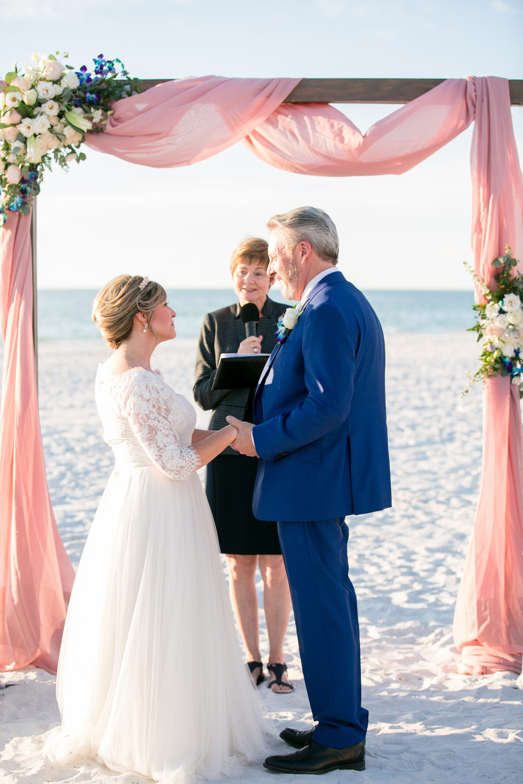 Classic Bride and Groom Exchanging Wedding Vows on Beach | Tampa Bay Wedding Photographer Carrie Wildes Photography | Wedding Officiant A Wedding with Grace | St. Pete Wedding Venue The Don CeSar
