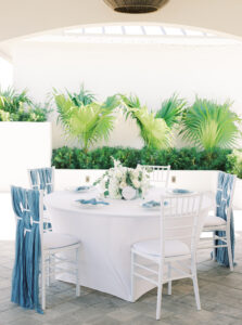 White Linen Table with White Florals and Greenery and White Chairs | Tampa Rentals Gabro Event Services