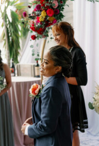 Vibrant Same Sex Lesbian Wedding, Bride Wearing Blue Suit Emotional Happy Reaction to Bride During Wedding Ceremony Portrait | Tampa Bay Wedding Photographer Dewitt for Love Photography | Wedding Hair and Makeup IDBM Artistry