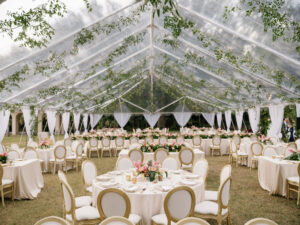 Luxurious Classic Outdoor Tent Wedding Reception Decor, Gold and Ivory Dining Chairs, Low Pink and Peach with Greenery Floral Bouquets, Hanging Greenery Garland, White Linens | Tampa Bay Wedding Venue Powel Crosley Estate