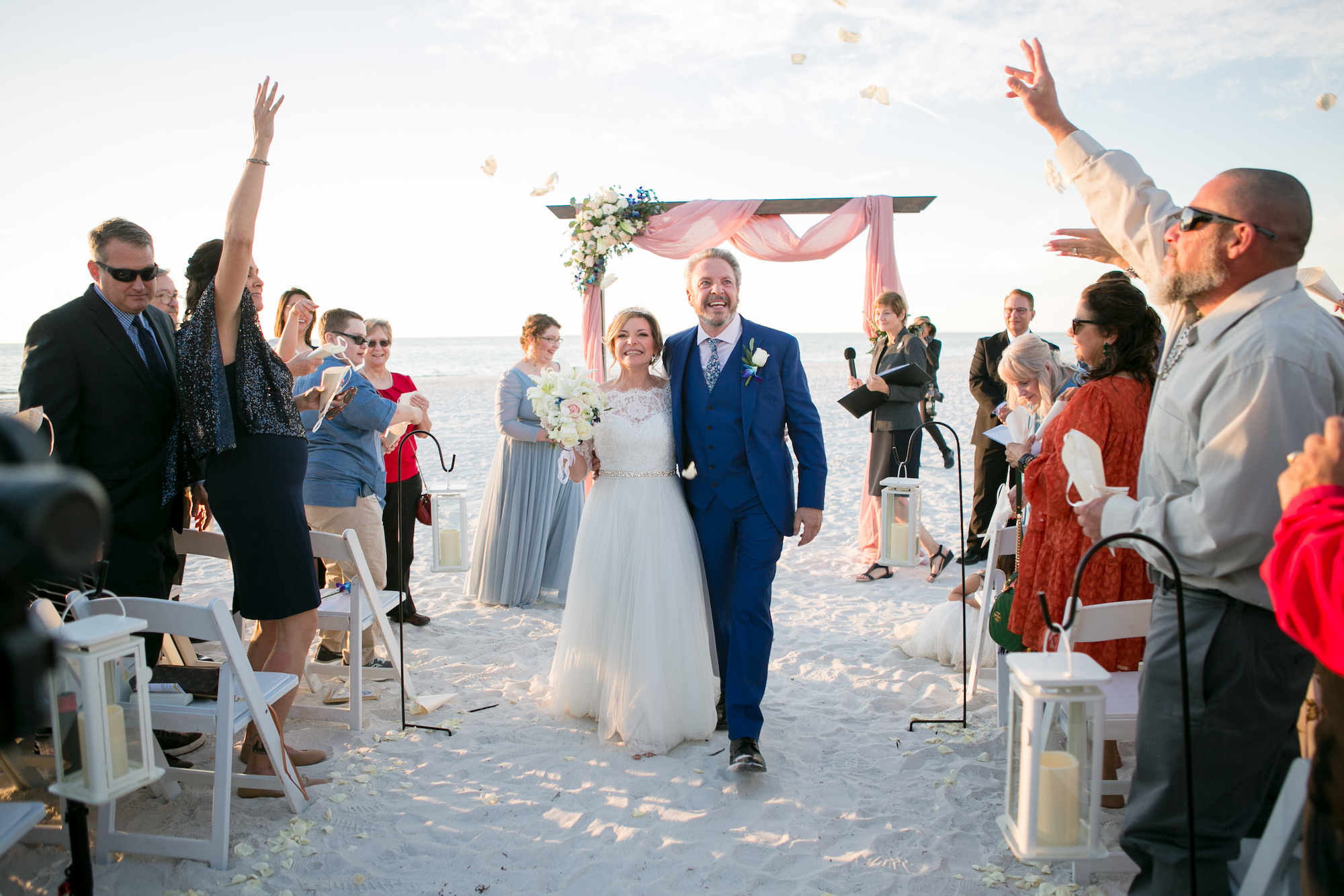 Classic Bride and Groom Exiting Wedding Ceremony Portrait, Guests Throwing Rose Petals | Tampa Bay Wedding Photographer Carrie Wildes Photography | Wedding Planner Breezin' Weddings