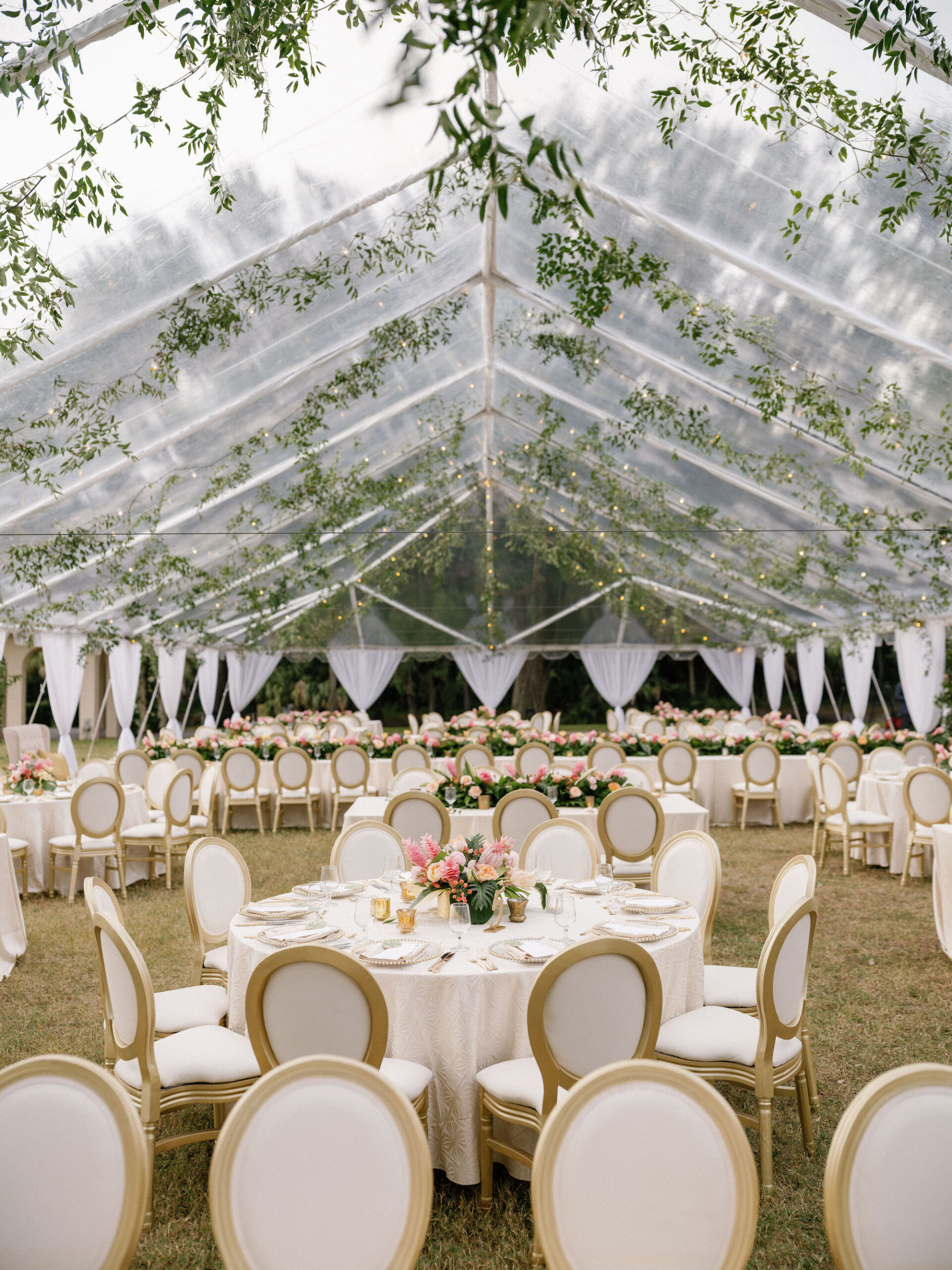 Luxurious Classic Outdoor Tent Wedding Reception Decor, Gold and Ivory Dining Chairs, Low Pink and Peach with Greenery Floral Bouquets, Hanging Greenery Garland, White Linens | Tampa Bay Wedding Venue Powel Crosley Estate | Tampa Bay Wedding Florist Botanica International Design Studio