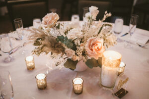 Cream and Pale Pink Floral Centerpiece with Greenery and Candlelit Tablescape Decor