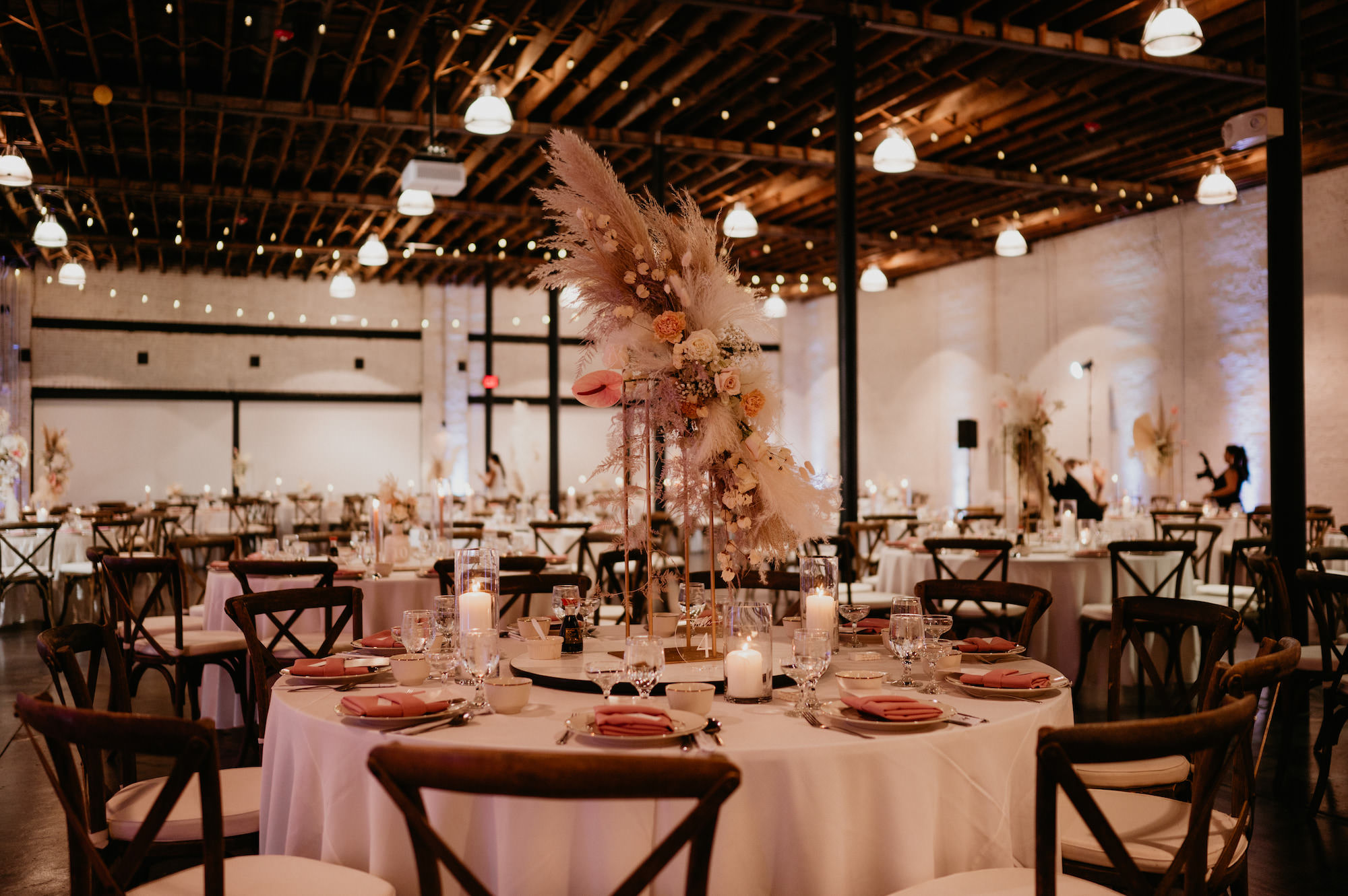 Boho Pampas and Pink and Cream Floral Centerpiece with Wooden Crossback Chairs Wedding Reception | Florida Wedding Venue Haus 820 | Tampa Florida Rentals A Chair Affair