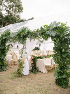 Luxurious Classic Wedding Tent Reception Decor, Lush Monstera Palm Leaves Arch | Tampa Bay Wedding Florist Botanica International Design Studio