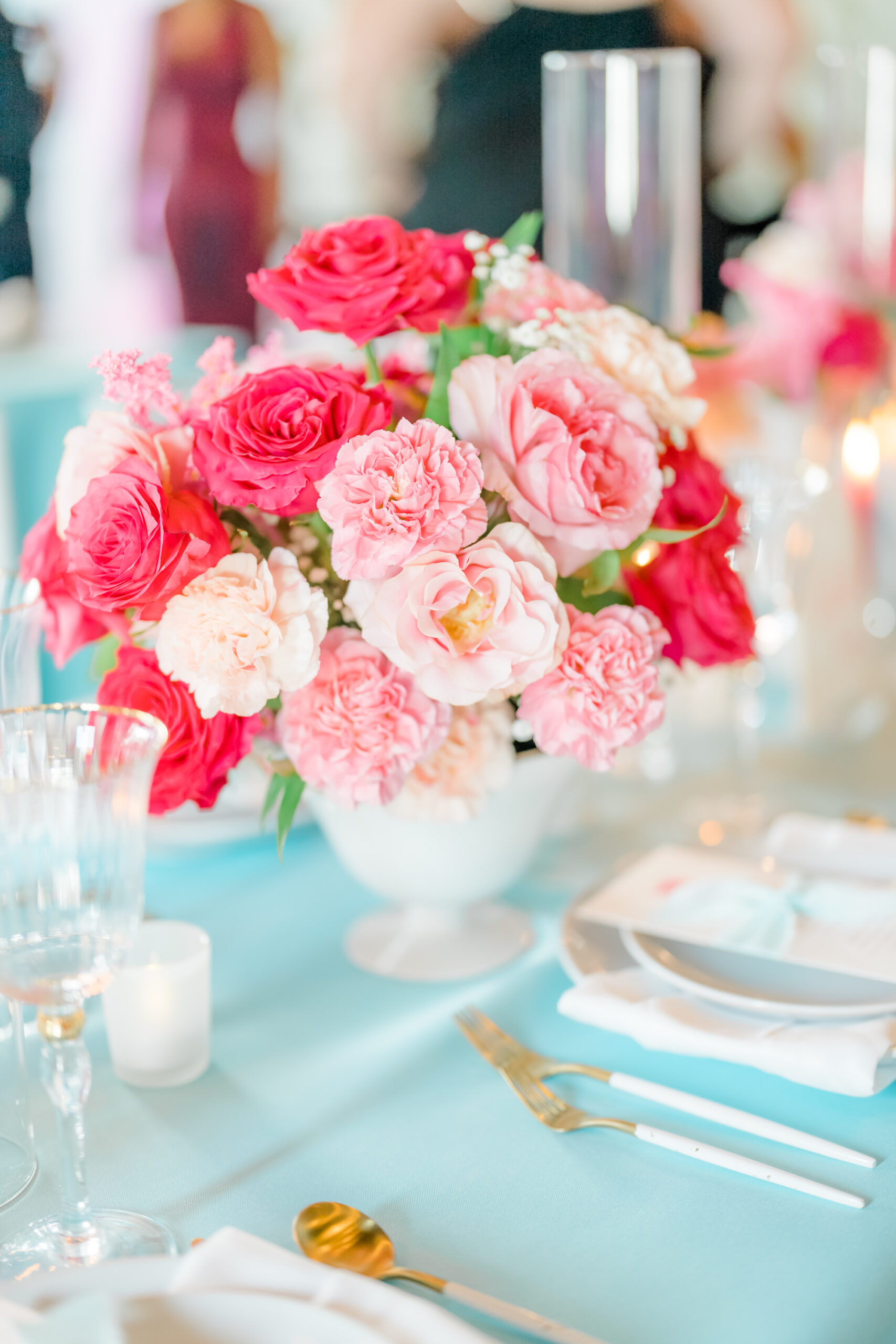 Summer Inspired Wedding Decor, Turquoise Table Linen, White and Gold Flatware, Low Pink and Fuchsia Roses Floral Centerpieces, Pink Candlesticks | St. Pete Beach Wedding Rentals Gabro Event Services