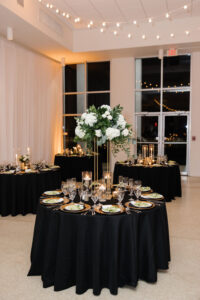 Classic Timeless Wedding Reception Decor, Black Table Linens, Gold Chargers, Floating Candles, Tall White Hydrangeas, Roses and Greenery Floral Centerpiece | Tampa Bay Wedding Florist Monarch Events and Design | Wedding Venue Tampa Garden Club