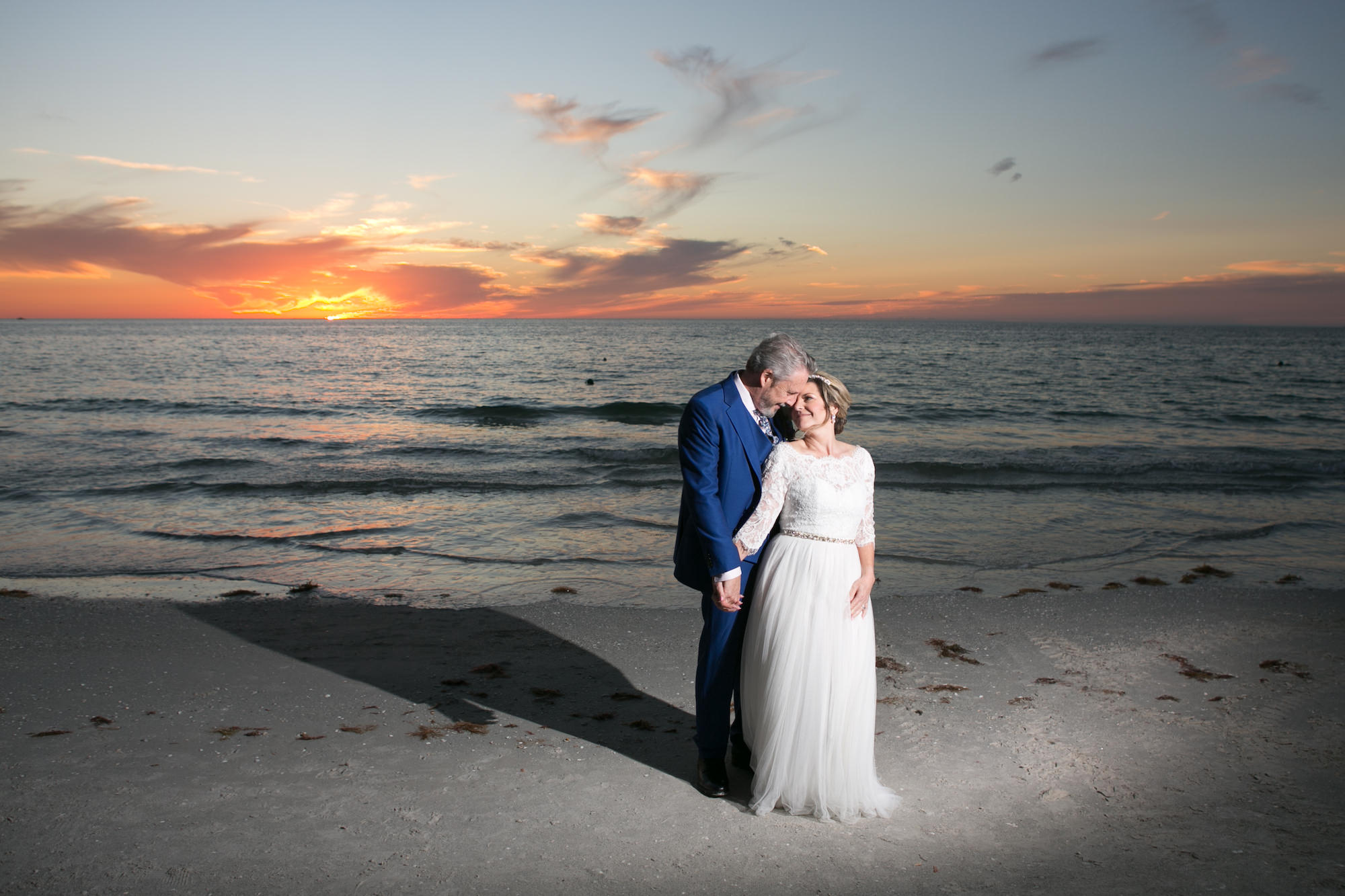 Sunset Classic Bride and Groom on Beach of St. Pete Historic Wedding Venue The Don CeSar | Wedding Photographer Carrie Wildes Photography