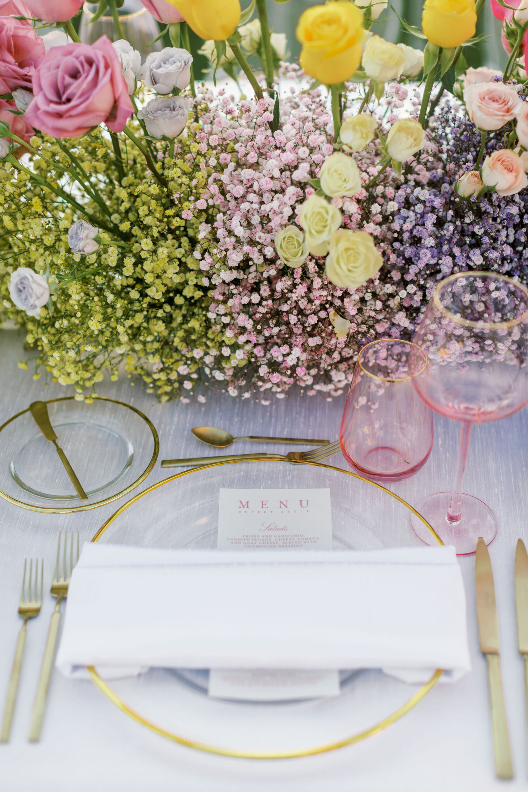 Colorful Spring Wedding Inspiration with Ombre Green, Pink, Yellow, and Purple Floral Centerpieces with Gold Charger