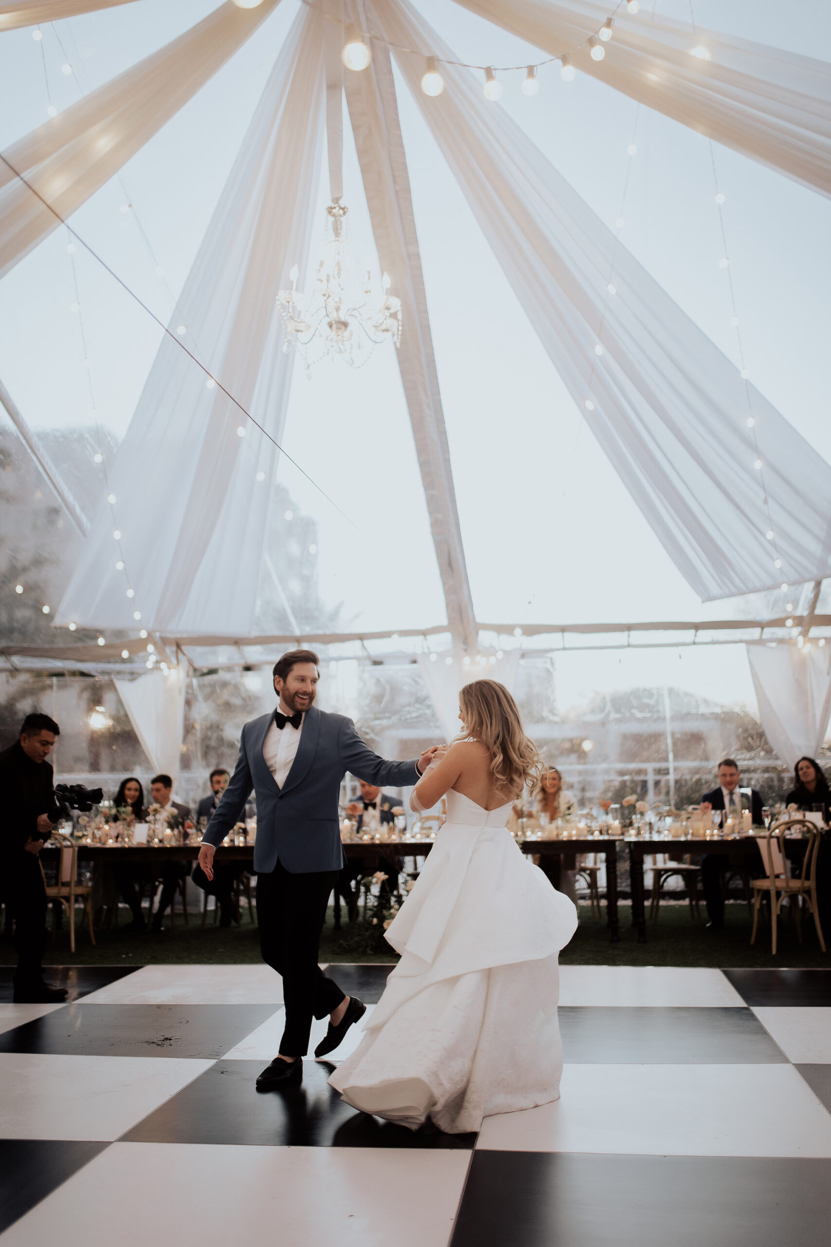 Bride and Groom First Dance | Black and White Checkered Dance Floor | Clearwater Wedding DJ Grant Hemond and Associates | Clearwater Planner Elegant Affairs By Design