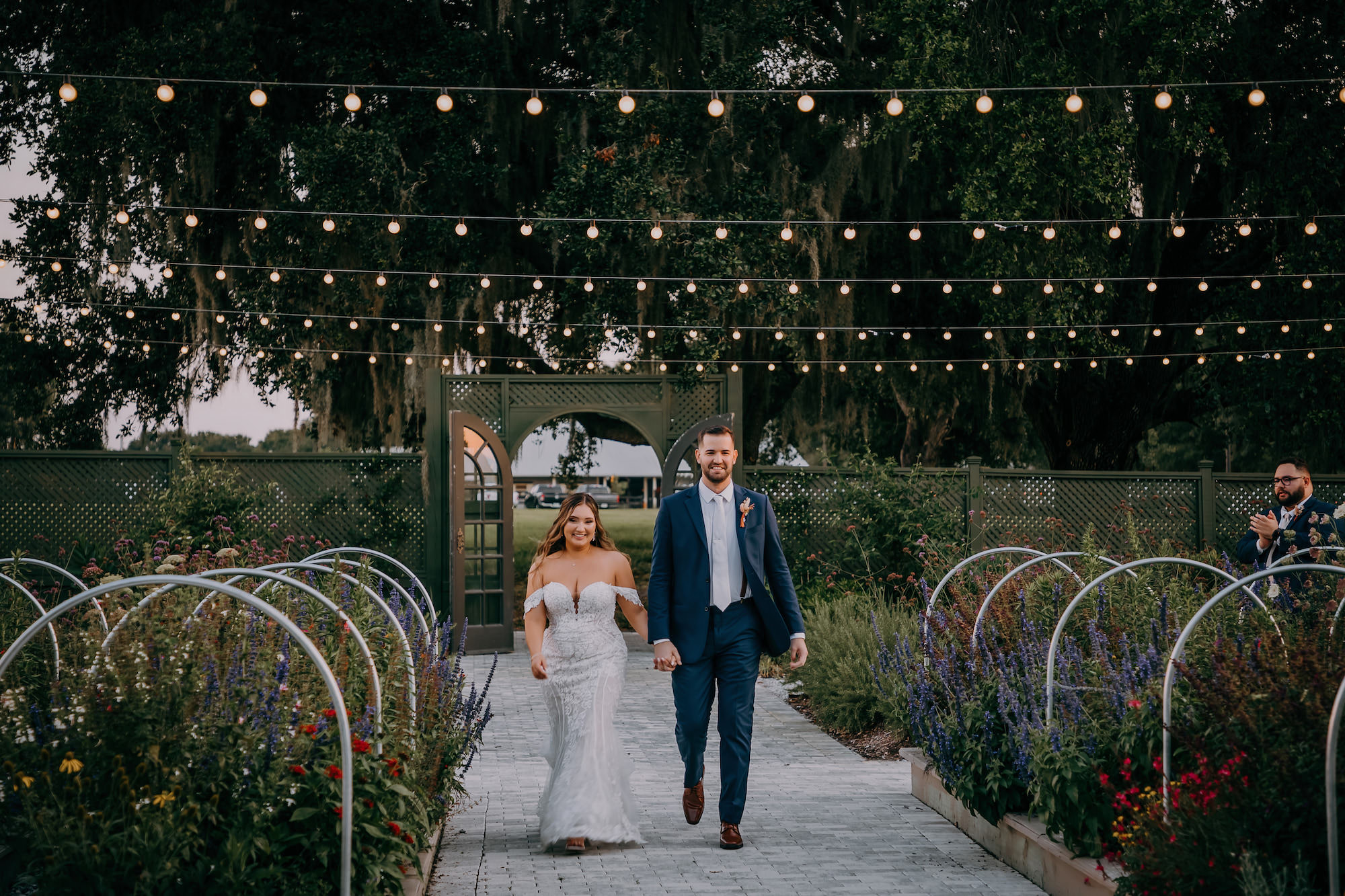 Boho Vintage Bride and Groom Outdoor Courtyard Wedding Reception Entrance | Tampa Wedding Venue Mill Pond Estate