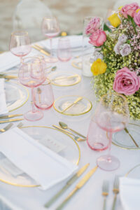 Colorful Spring Wedding Inspiration with Ombre Green, Pink, Yellow, and Purple Floral Centerpieces with Gold Charger