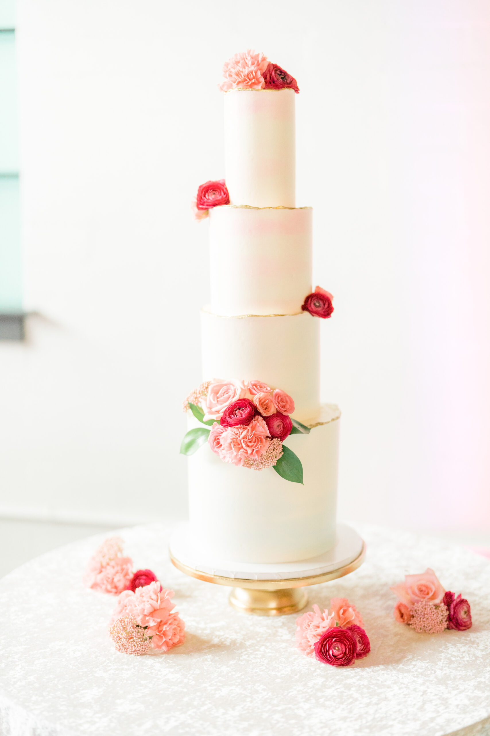 Four Tier Tall White Romantic Wedding Cake with Pink and Fuchsia Flowers