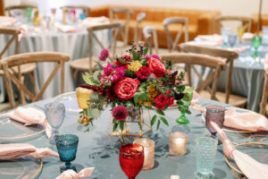 Vibrant Wedding Reception Decor, Clear and Gold Trim Chargers, Blush Pink Linen Napkins, Colorful Vintage Water Goblets, Low Floral Centerpiece, Red and Pink Roses, Fuschia and Yellow Flowers, Greenery Leaves Centerpiece, Wooden Cross Back Chairs | Tampa Bay Wedding Photographer Dewitt for Love Photography | Wedding Rentals Gabro Event Services