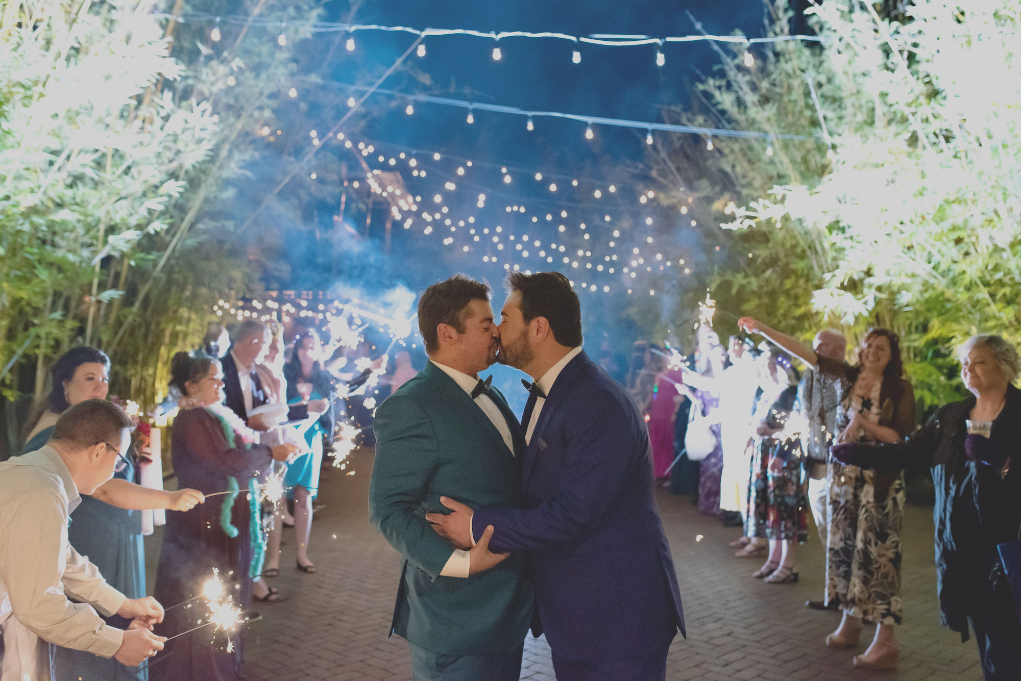 Two Grooms in Jewel Toned Tropical Inspired Suits Sparkler Exit Wedding Portrait| St. Pete Wedding NOVA 535 | Florida Wedding Photographer Kristen Marie Photography