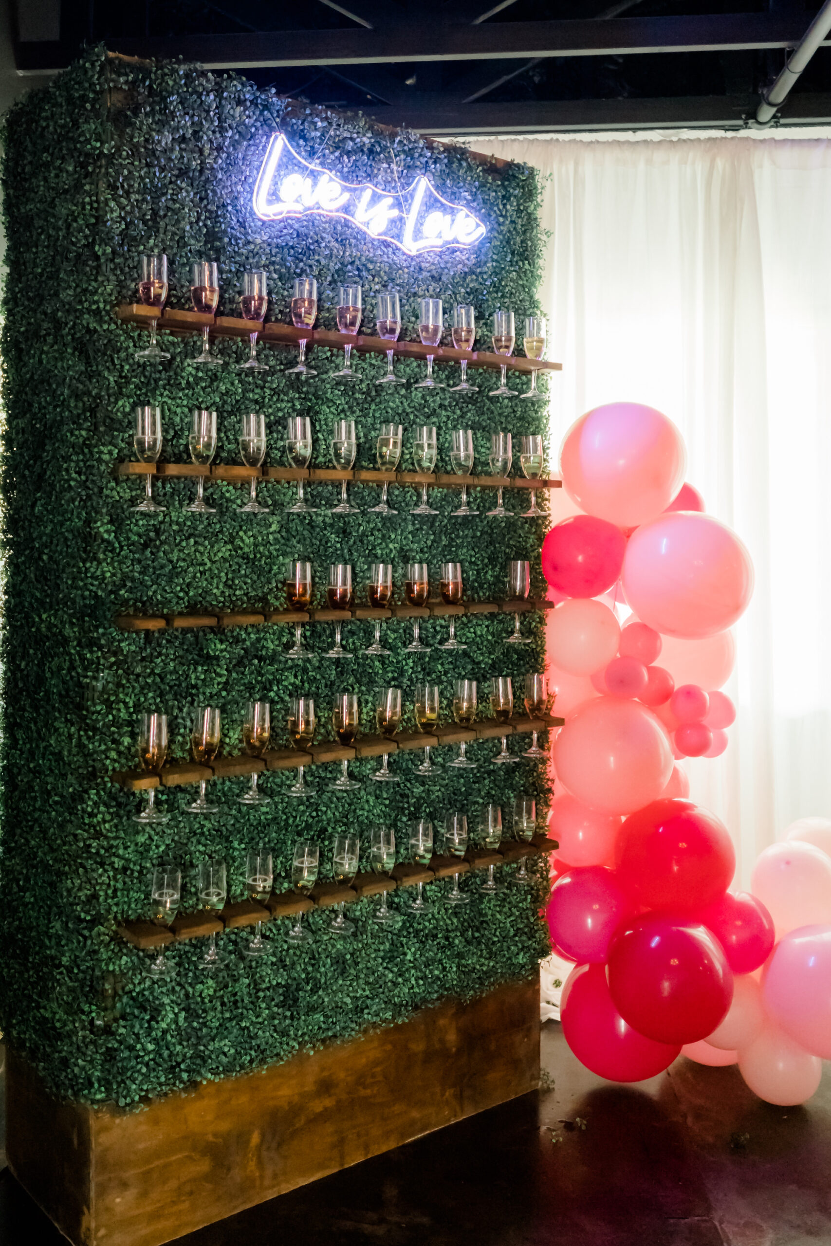 Whimsical Wedding Reception Decor, Pink Balloons, Greenery Panel Champagne Wall with White Neon Love is Love Sign | Tampa Bay Wedding Rentals Gabro Event Services | Venue The West Events