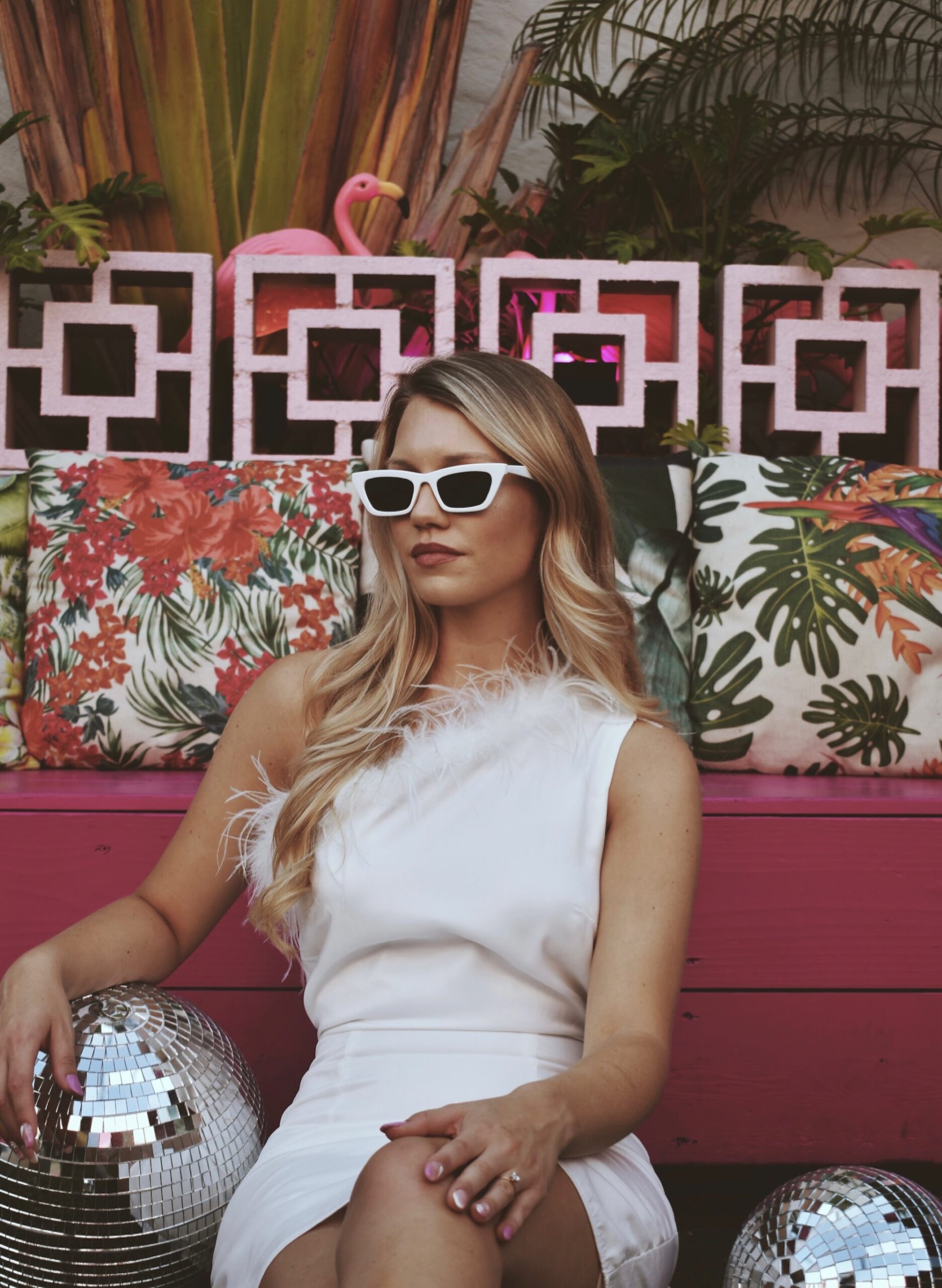 Bride in White Sunglasses Holding Disco Ball at Bar in St. Petersburg Florida for Bachelorette Party | Photographer The Gadabout Captures