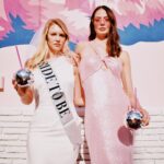 Bride with Bride to Be Sash and Bridesmaid in Pink Glittery Floor Length Dress Holding Disco Cups During Bachelorette Party | Tampa Bay Bach Party Ideas | Photographer The Gadabout Captures