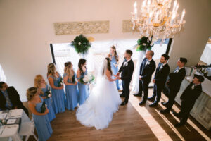 Intimate Indoor Wedding Ceremony Bride and Groom Exchange Vows Portrait | Dunedin Wedding Venue Beso Del Sol