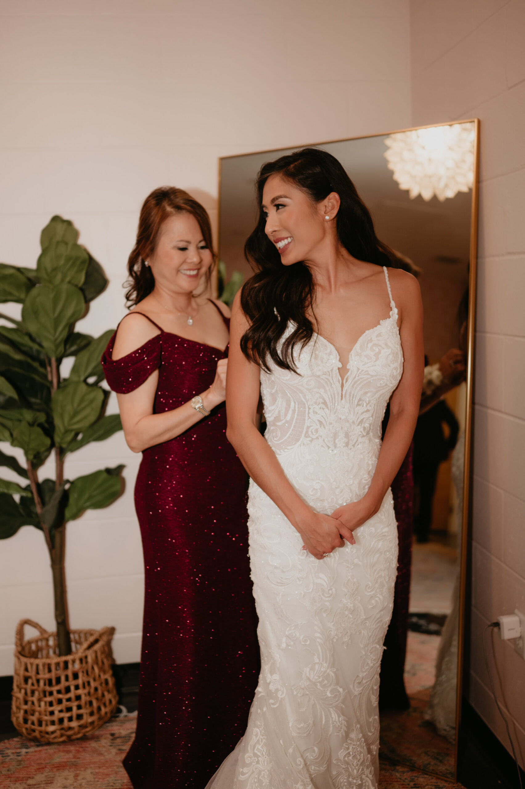 Bride Getting Ready with Mother of the Bride in Sleek Fitted Boho Wedding Dress Portrait