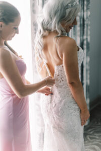 Getting Dressed with Bridesmaid White Lace Maggie Soterro Mermaid Spaghetti Strap Zipper Button Wedding Dress