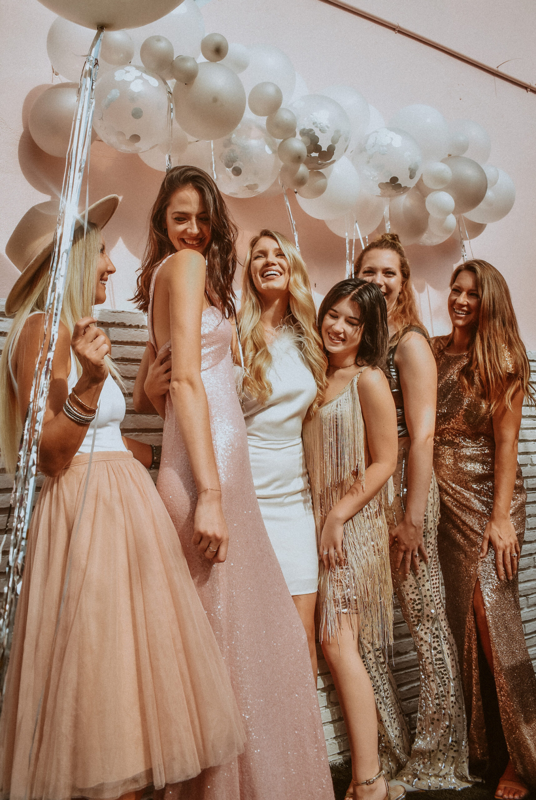 Bride and Bridesmaids in Mix and Match Gold and Blush Outfit Ideas at Bachelorette Party | St. Pete Bachelorette Photographer The Gadabout Captures