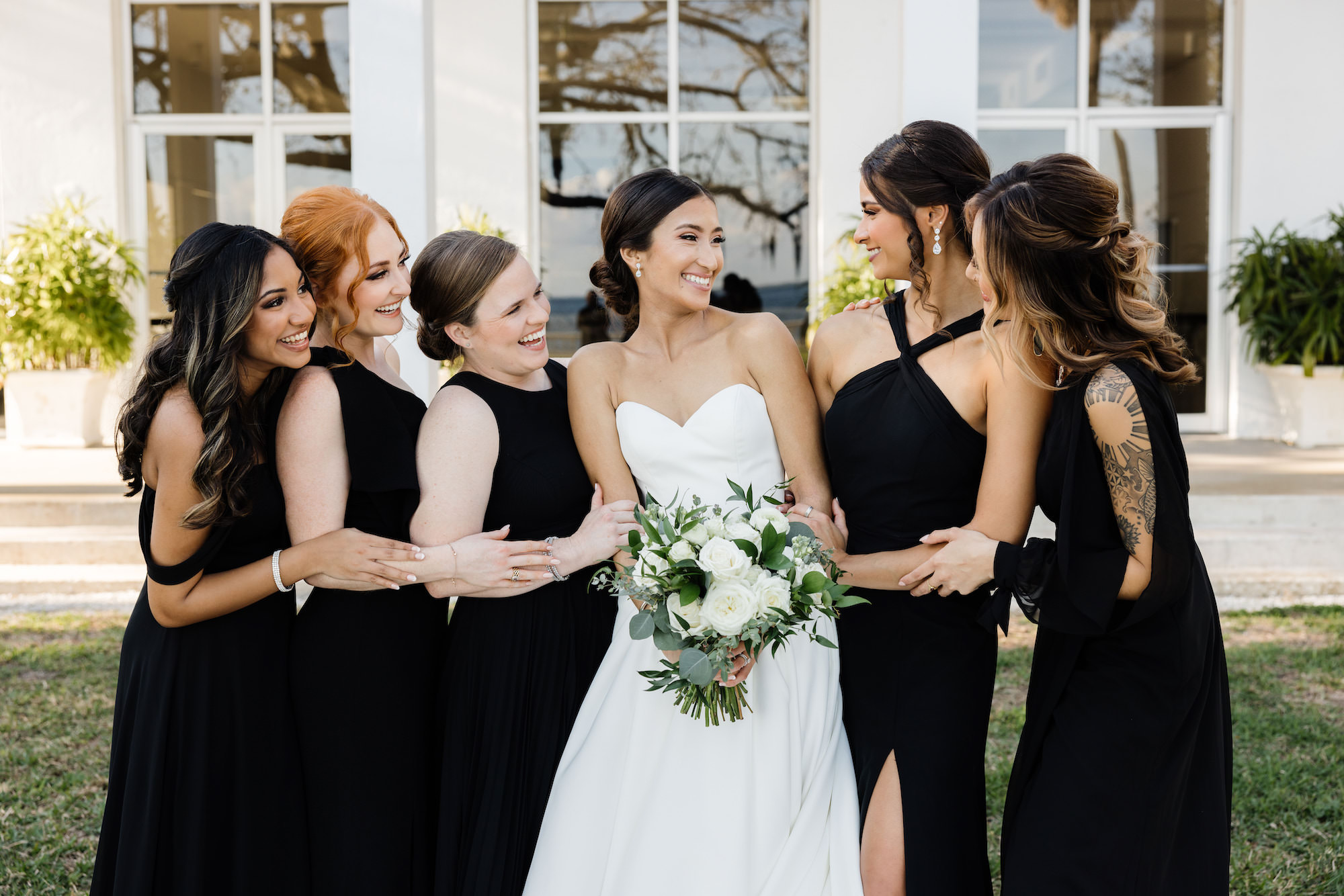 Classic Bride with Bridesmaids Wearing Mix and Match Black Dresses | Tampa Bay Wedding Hair and Makeup Femme Akoi Beauty Studio | Wedding Florist Monarch Events and Design